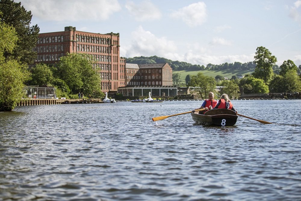 Rowing boat on river at Belper
