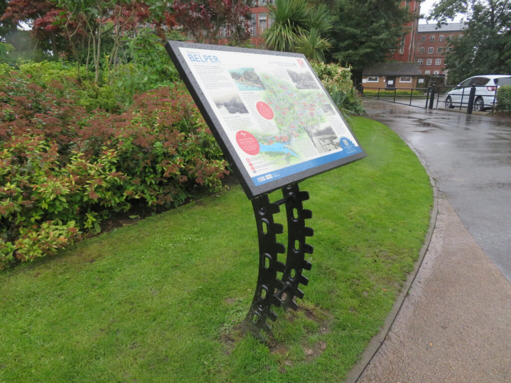 Information board about Belper in the River gardens. On a waterwheel style stand.