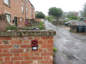 Water wheel plaque and QR code as part of Belper wayfinding scheme